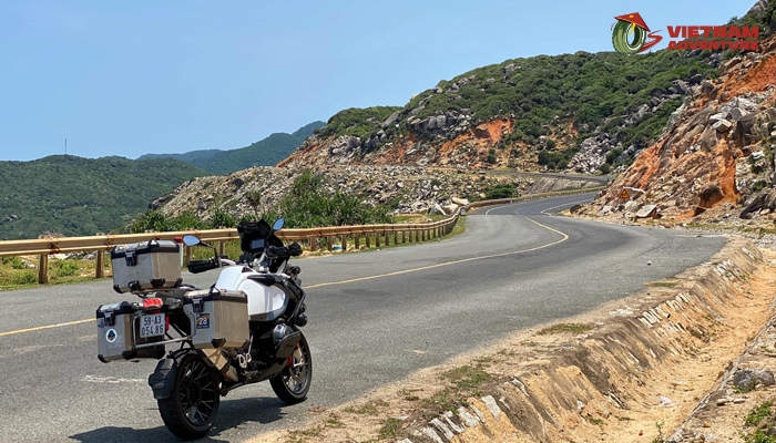 Motorcyclist riding through a breathtaking Vietnamese landscape